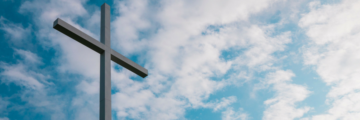 Photo of a cross representing the crucifixion that we remember during Holy Week | Sparkhouse Blog