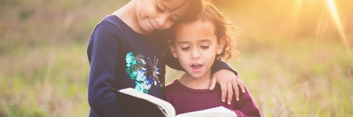 Two children read the Bible together | Sparkhouse Blog