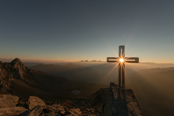 Sunshine peaking through a cross | Sparkhouse Blog