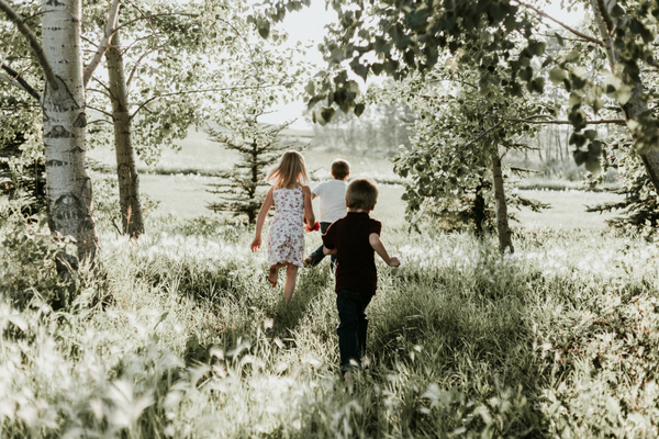 Three kids run outside | Sparkhouse Blog