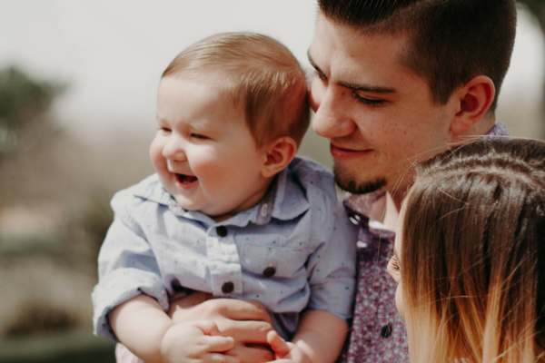 Happy baby feels confident with parents | Sparkhouse Blog