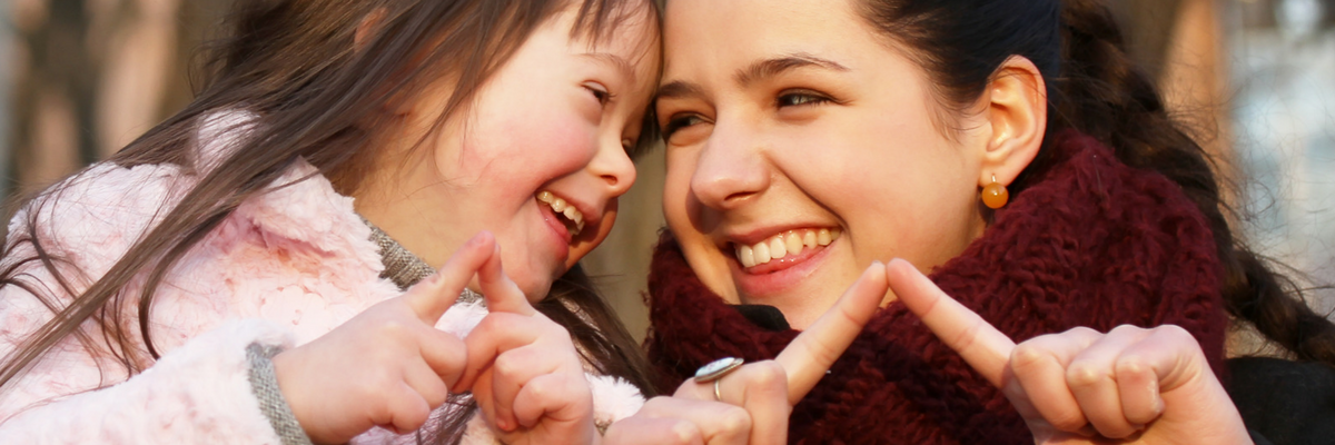 A kid and mentor use sign language to communicate | Sparkhouse Blog